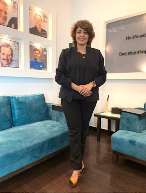 Malavika Mukhopadhyay, growth strategy consultant at Noventra, standing in a modern corporate office setting